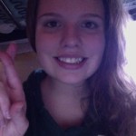 COURTESY PHOTO / JENNIFER HARTLEY. Club member Jennifer Hartley signs "R" in ASL.
