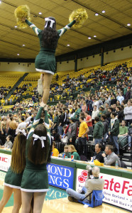 College cheerleaders lead a chant in a January home game. ALISON COHEN / THE FLAT HAT