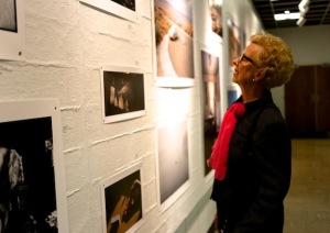 One of the many viewers who enjoyed the exhibit during opening night. CAROL PENG / THE FLAT HAT