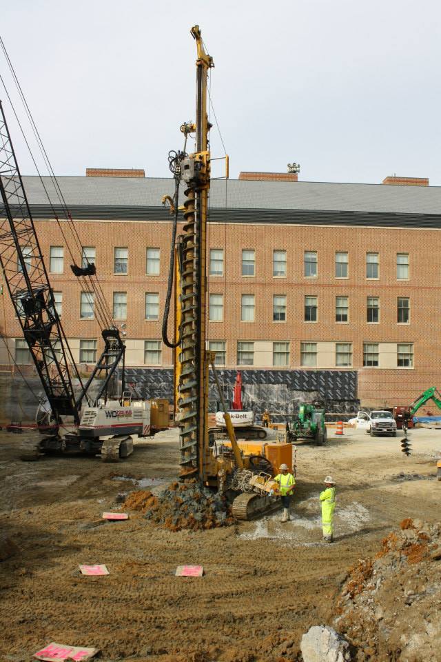 This is the earliest stage of construction on the base of ISC 3. The large drill depicted is creating multiple holes in the ground, which will be filled with heavy material, using compression to pack the dirt together and create a strong base for the new building.  BAILEY KIRKPATRICK / THE FLAT HAT