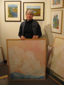 Chee Kludt Ricketts displaying one of her paintings. SARAH RUIZ / THE FLAT HAT