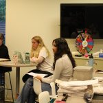 Director of Student Leadership Development Anne Arseneau ’89 MA.Ed ’92, SA President Sydney Thayer '24, SA Secretary of Data and Analytics Varsha Gollarhalli '25 and SA Secretary of Student Life Daly Martorano '24 at the May 2, 2023 SA Senate meeting.