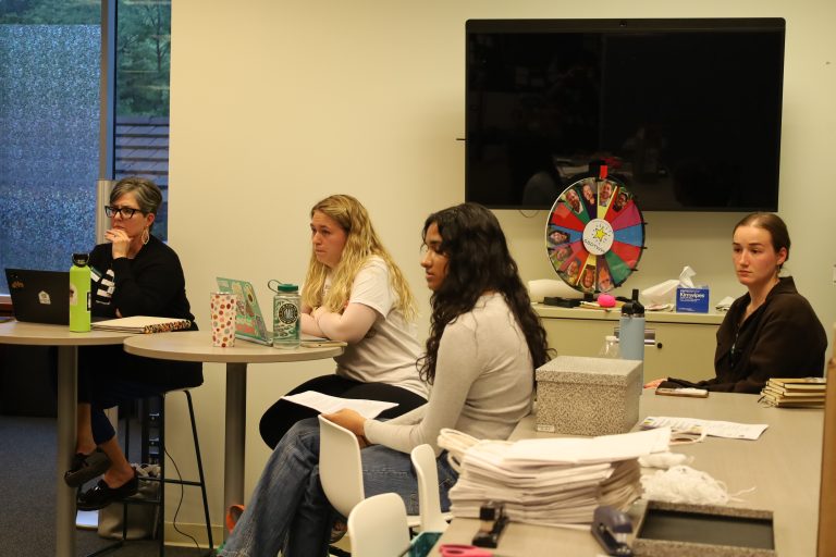 Director of Student Leadership Development Anne Arseneau ’89 MA.Ed ’92, SA President Sydney Thayer '24, SA Secretary of Data and Analytics Varsha Gollarhalli '25 and SA Secretary of Student Life Daly Martorano '24 at the May 2, 2023 SA Senate meeting.