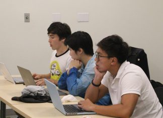 Sen. Spencer Krivo ’26, a sponsor of The COVID Tests on Campus Act, speaks during the Senate meeting. PEERAWUT RUANGSAWASDI // THE FLAT HAT